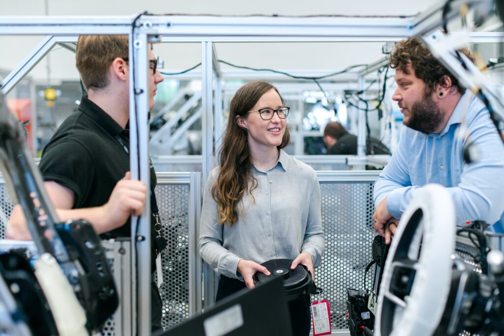 Tech professionals collaborating on a project in a high-tech environment